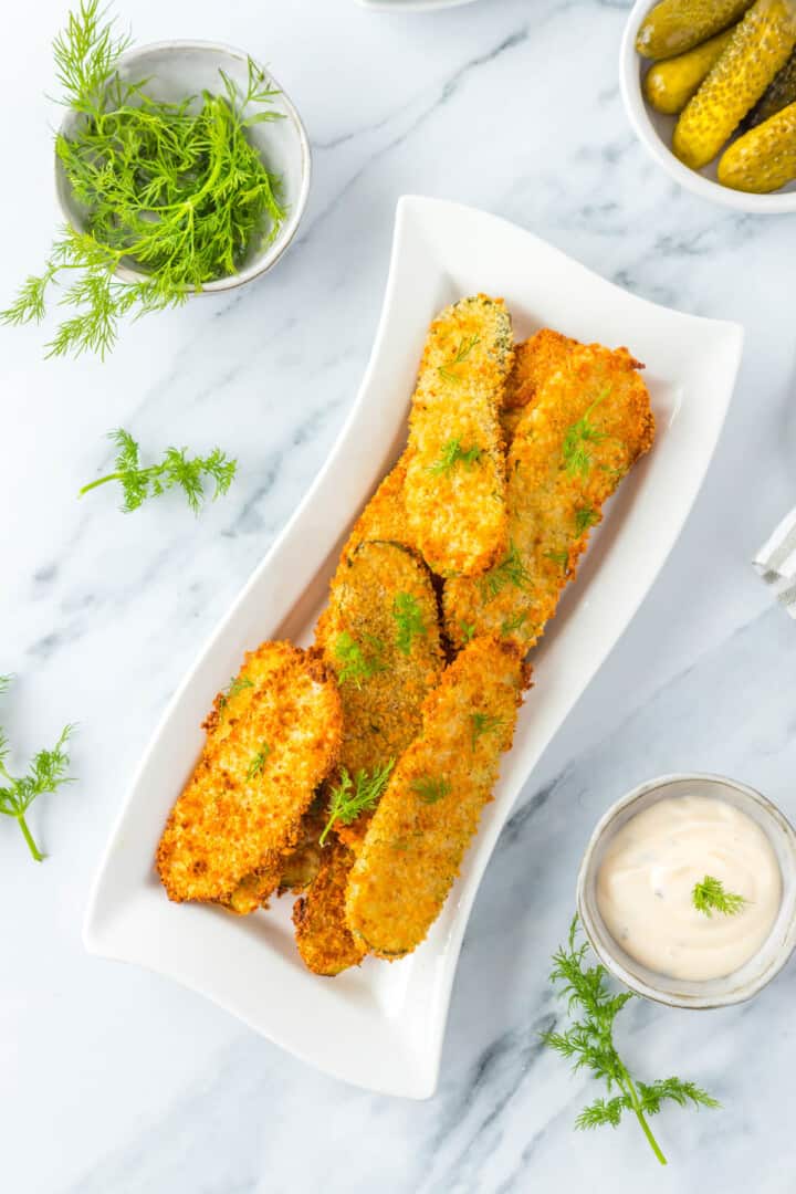 Air Fryer Fried Pickles on white serving tray.