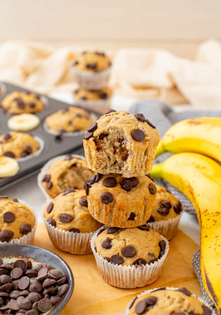 banana chocolate chip muffins stacked on top of each other