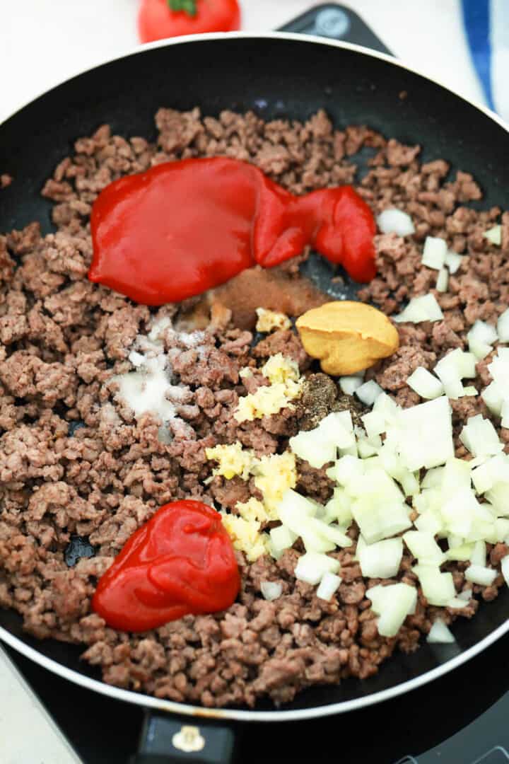 cooking ground beef and spices and sauces