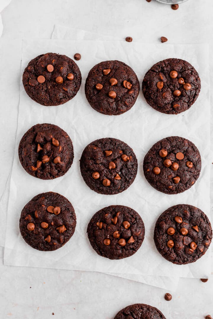 double chocolate chip cookies baked on wax paper on counter