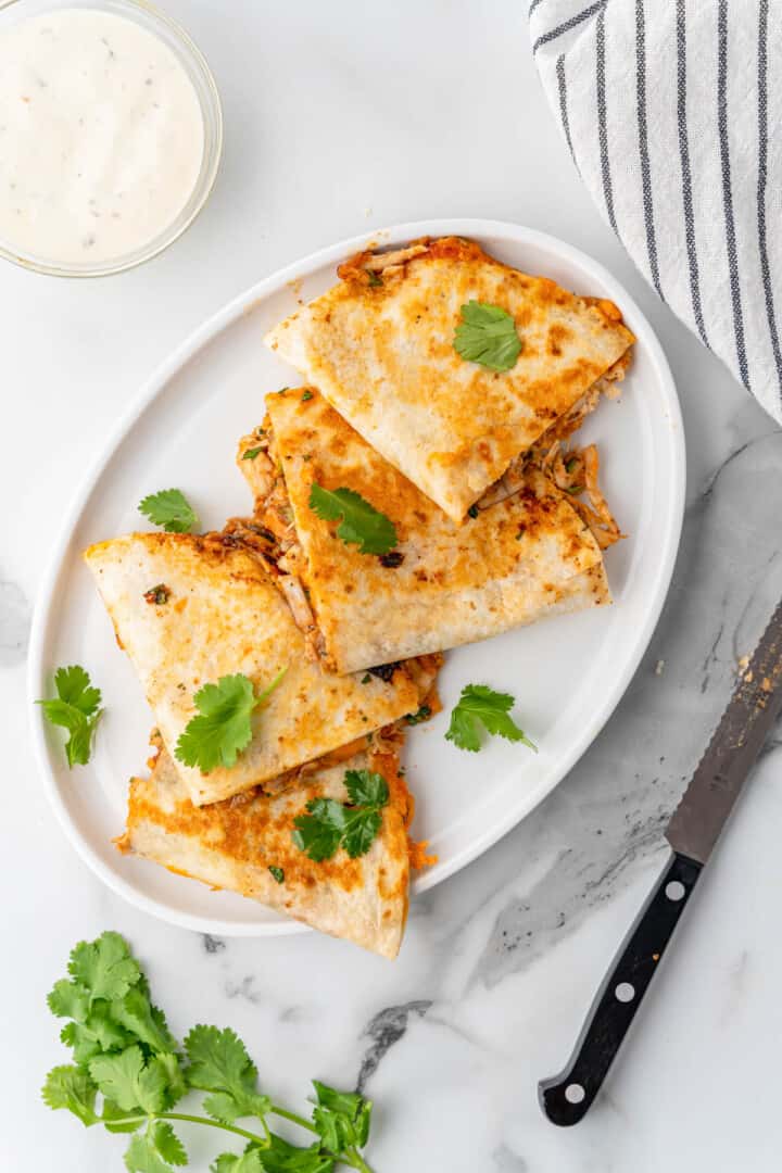 sliced quesadillas on white serving plate