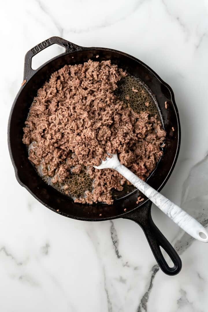 cooking sausage in a skillet