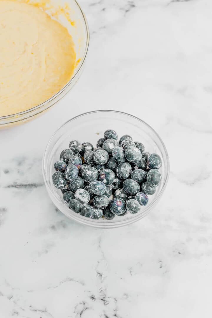 closeup of blueberries in glass bowl.
