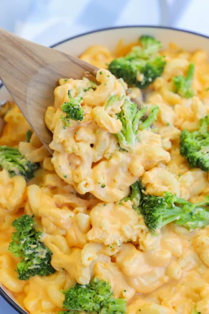 serving broccoli mac and cheese out of the pot.