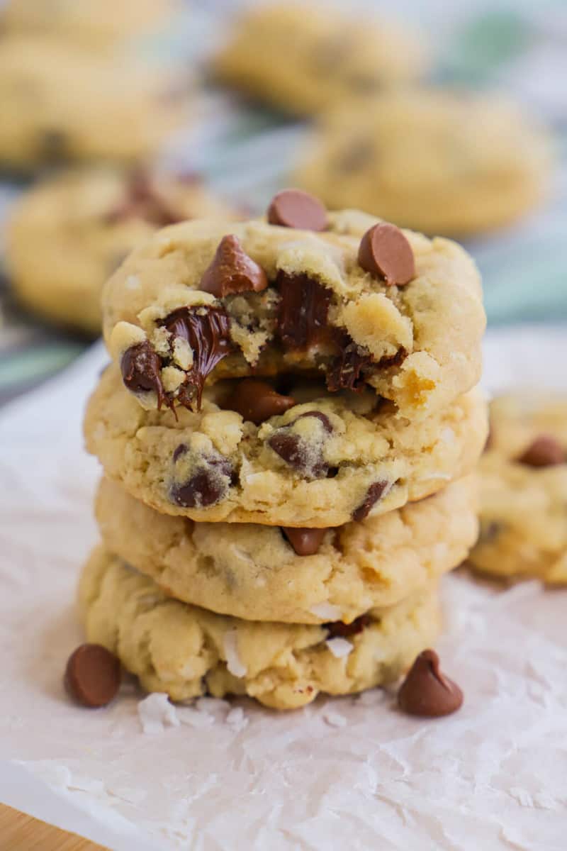 Coconut Chocolate Chip Cookies stacked on top of each other.