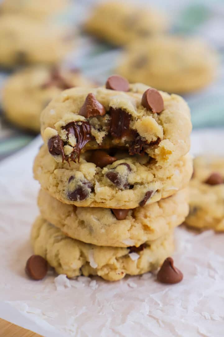 Coconut Chocolate Chip Cookies stacked on top of each other.