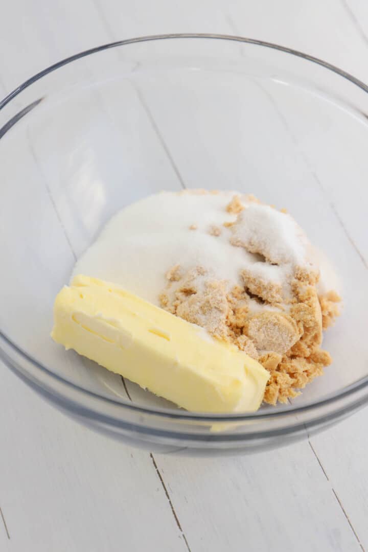 mixing the butter and sugars for the cookies.