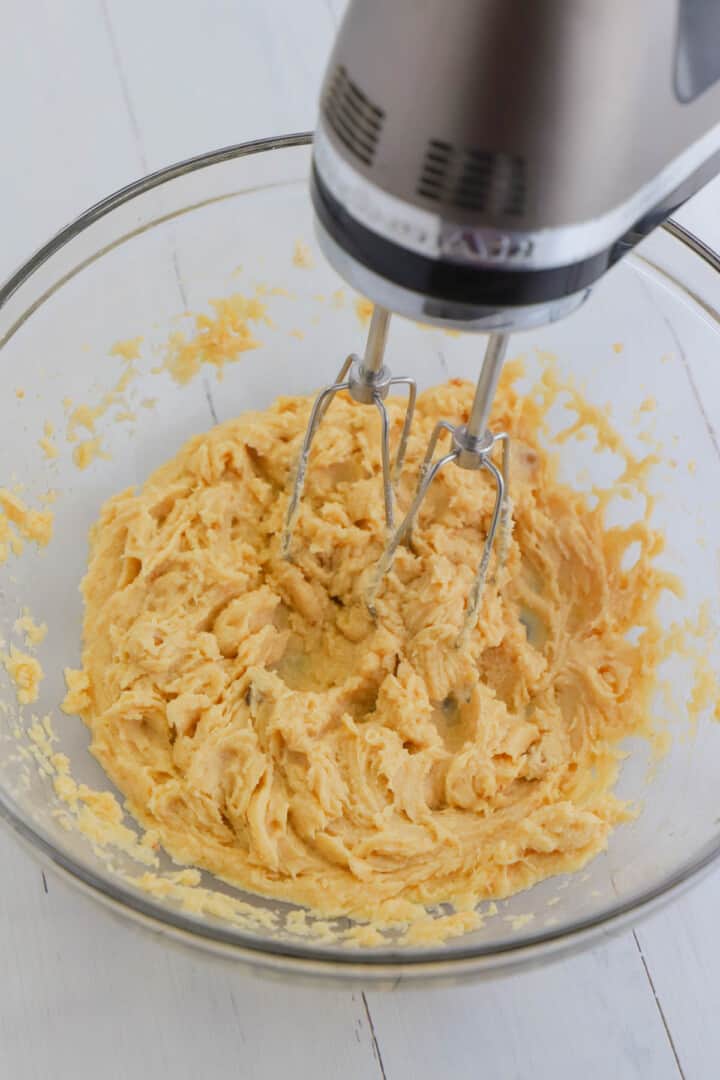 mixing in the eggs and vanilla to the dough.