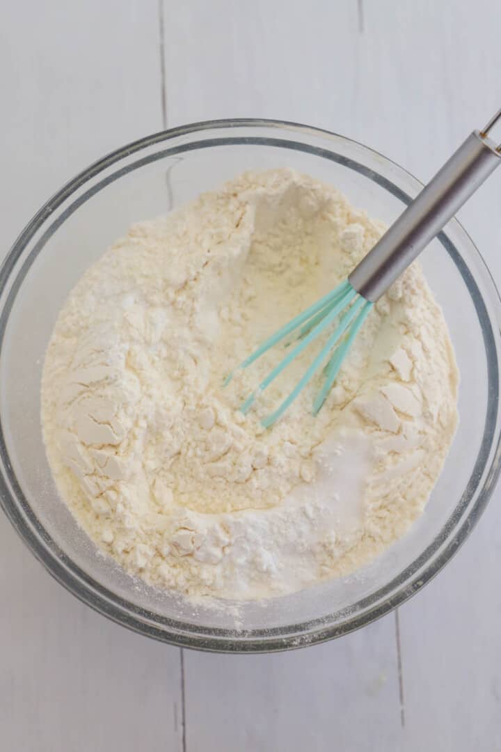 whisking together the dry ingredients for the cookie dough.