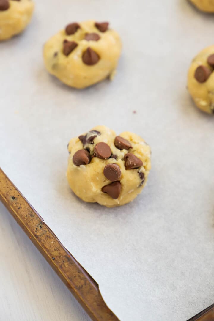 cookie dough balls on baking sheet.