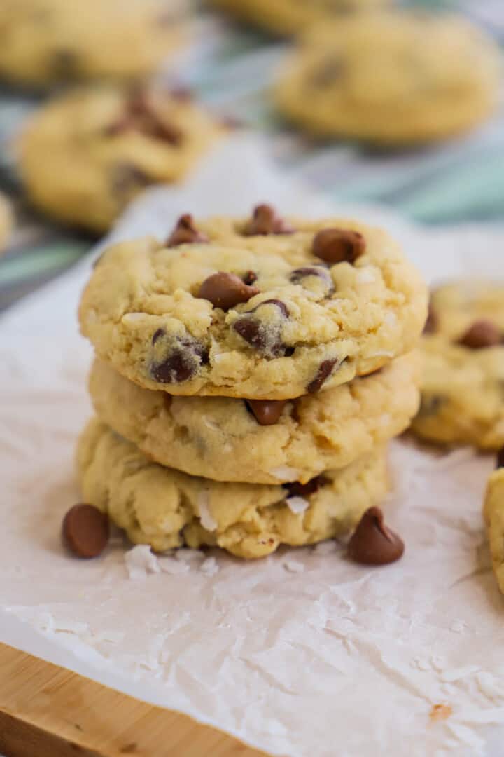 closeup of stacked cookies on wooden board.