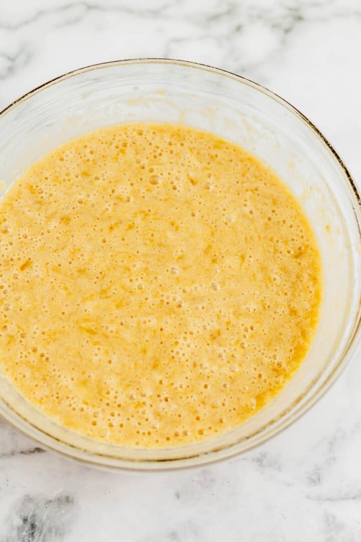 mixing together the wet ingredients for the banana bread.