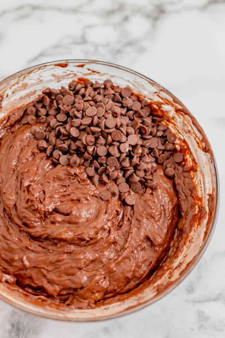 adding the chocolate chips to the banana bread batter