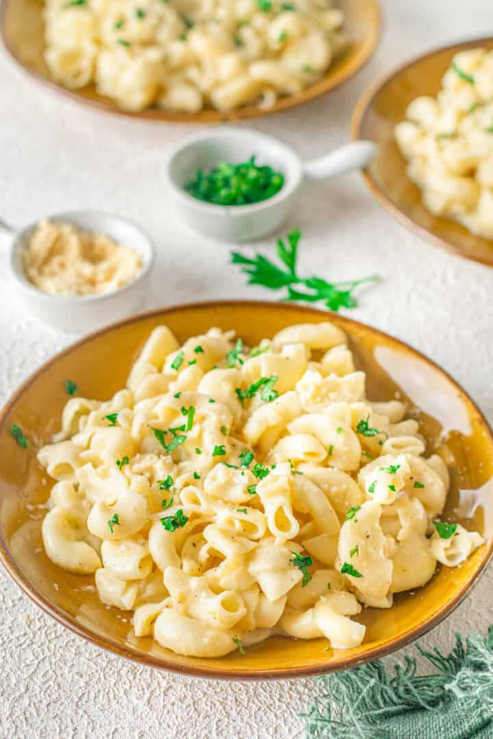 Instant Pot Mac and Cheese in bowl topped with parlsey