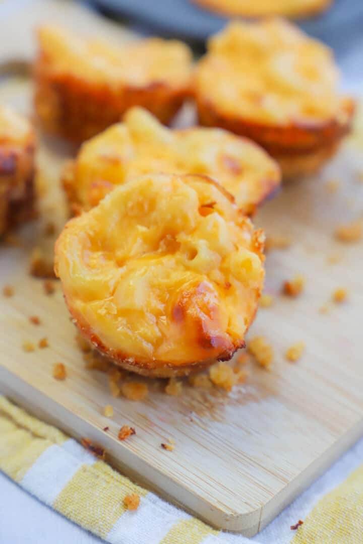 Mac and Cheese Bites on wooden serving board