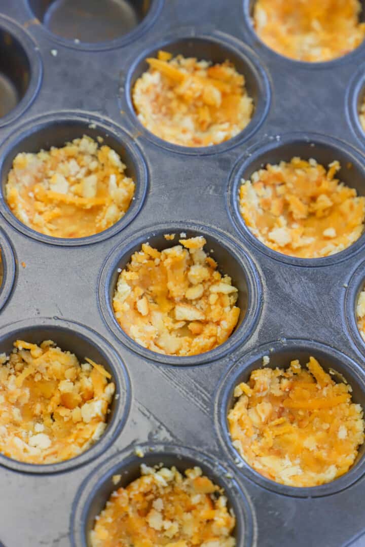 crust in the bottom of the muffin tin.