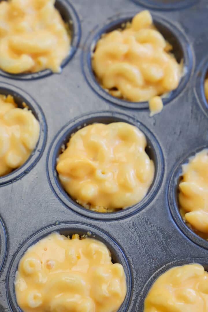 adding mac and cheese on top of the crust.