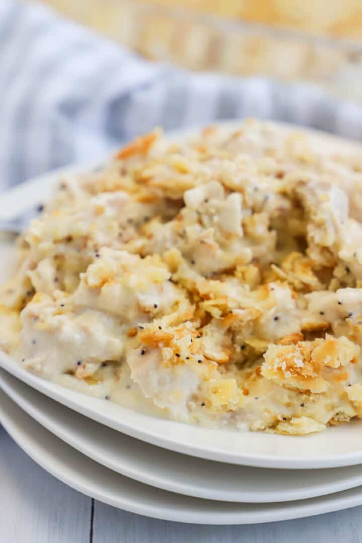 poppy seed casserole on stacked white plates.