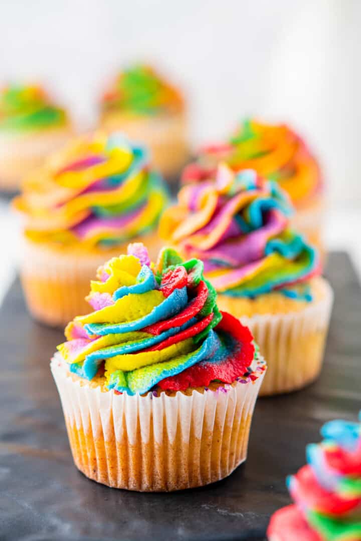 Rainbow Cupcake on serving board.