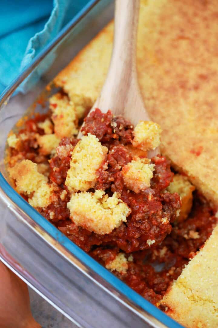 Sloppy Joe Casserole being scooped out with wooden spoon