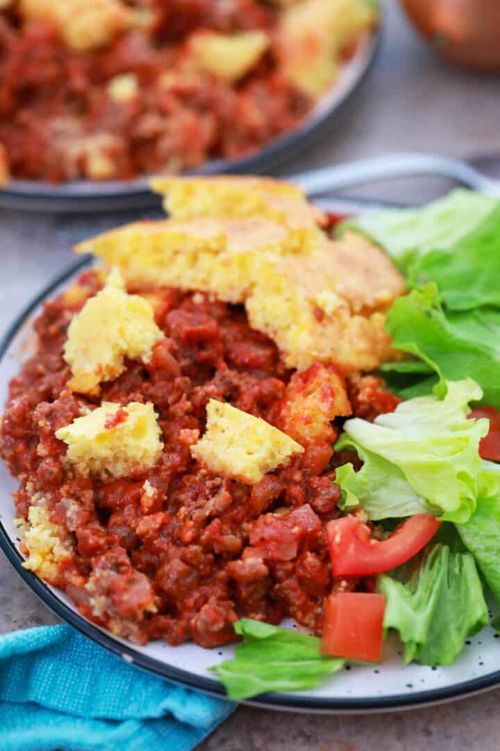 closeup of Sloppy Joe Casserole on plate with salad