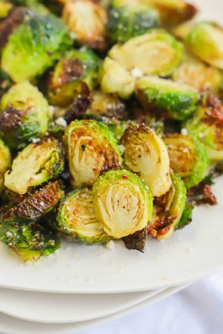 Air Fryer Brussels Sprouts on white plate.