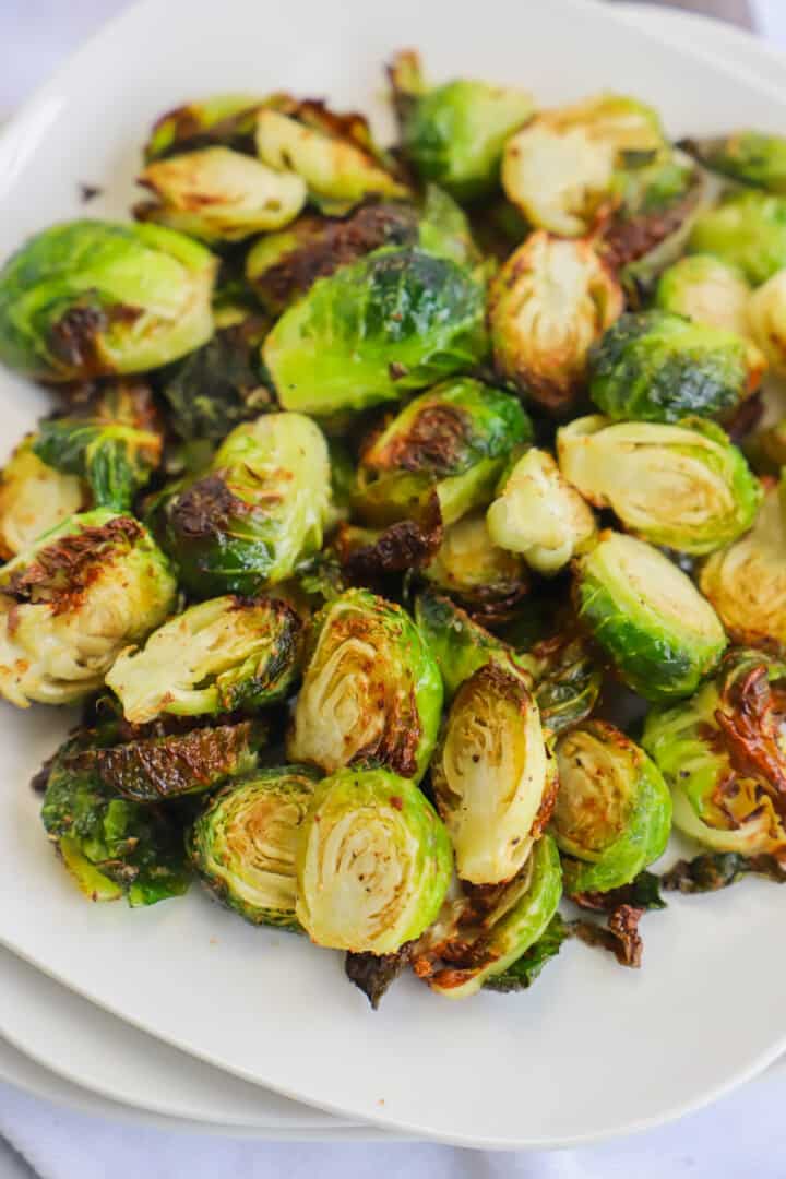 Air Fryer Brussel Sprouts on white plate.