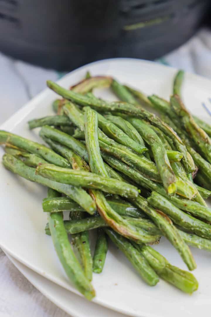 Air Fryer Green Beans on white plates. 