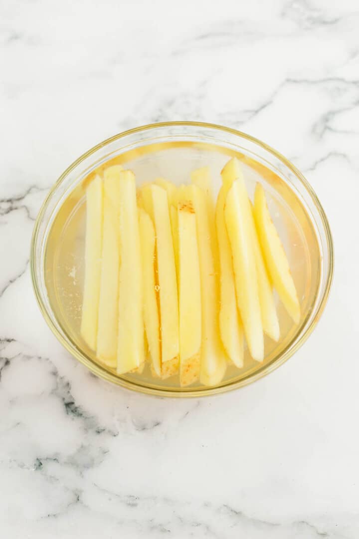 soaking potatoes in water. 