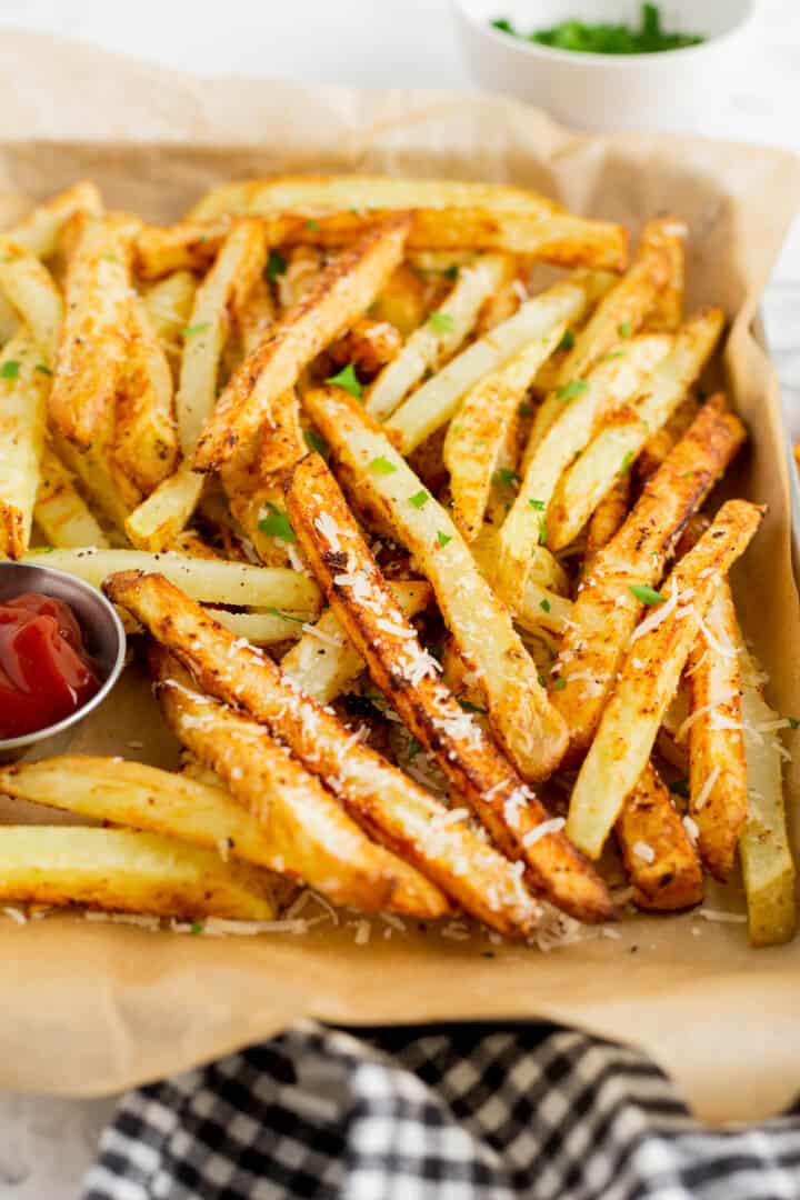 closed up of Garlic Parmesan French Fries on serving tray.