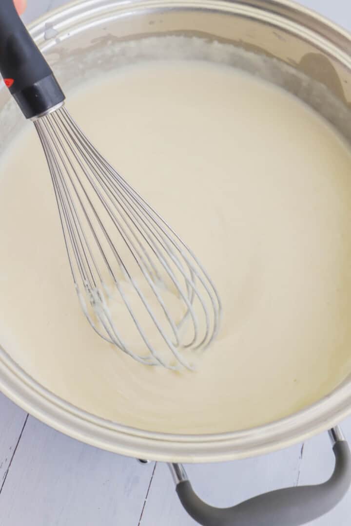 making the cheese sauce for the mac and cheese.