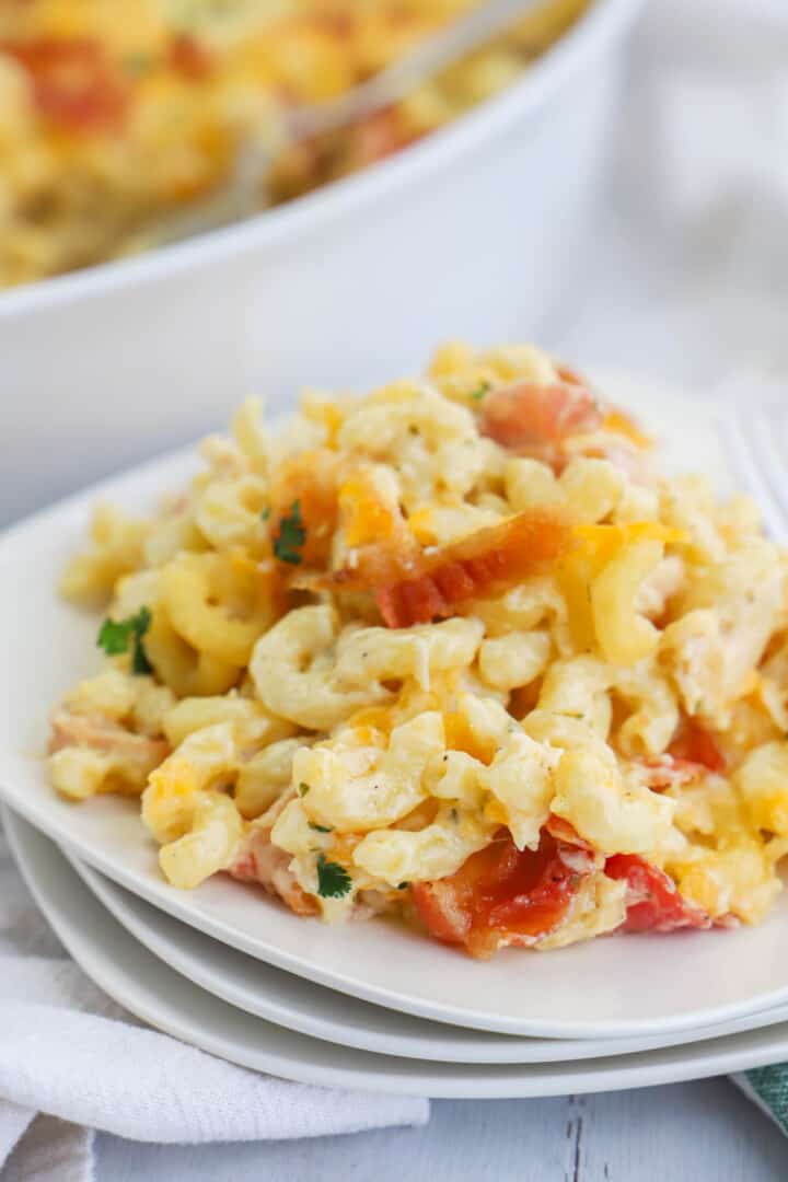 bacon ranch mac and cheese on stacked white plates.