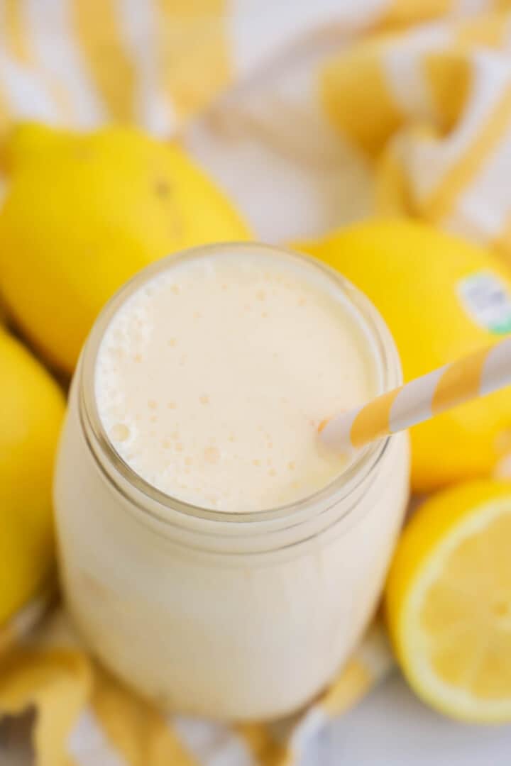 topview of frosted lemonade with lemons on the side.