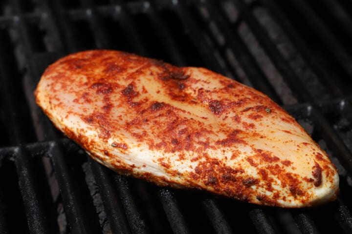 seasoned chicken on the grill.