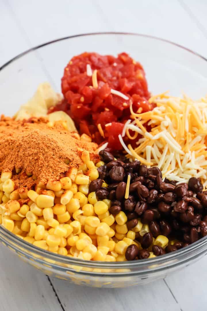 ingredients for the Mexican chicken casserole in glass mixing bowl.