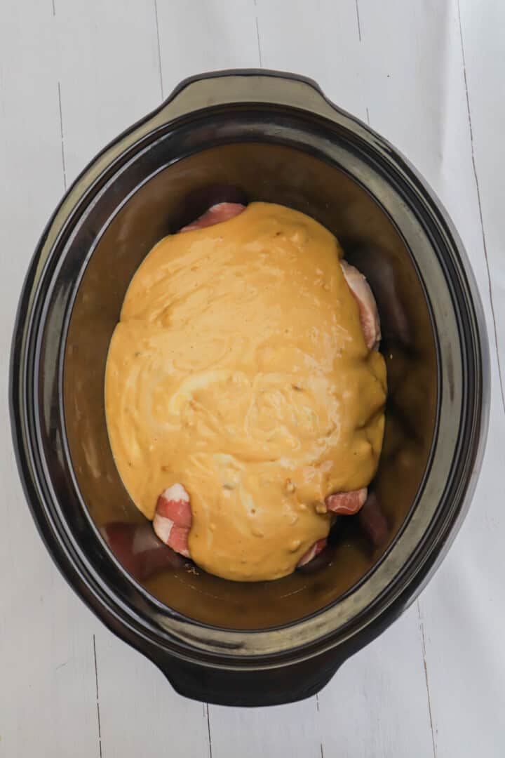 all ingredients for the smothered pork chops in the slow cooker.