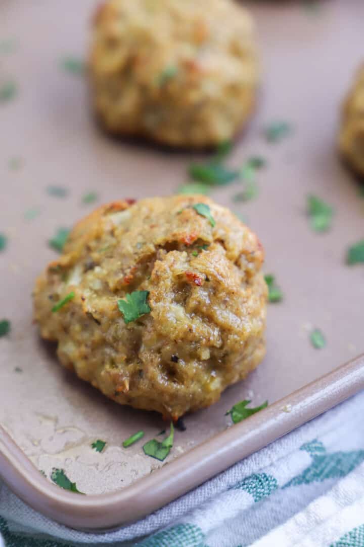 baked turkey meatballs on baking sheet.