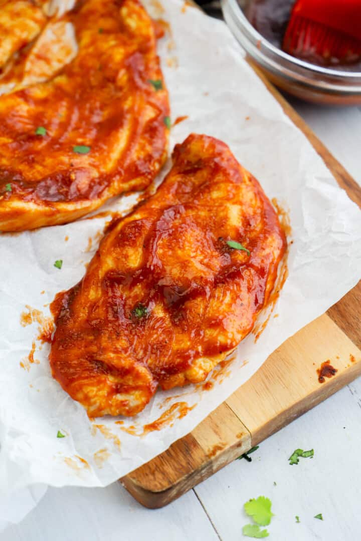 Air Fryer BBQ Chicken on wooden serving board.