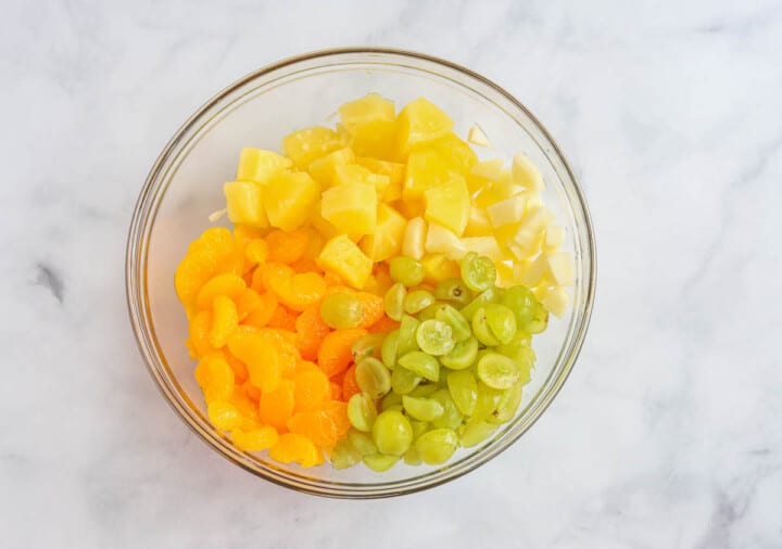 all the fruit in a large glass bowl.