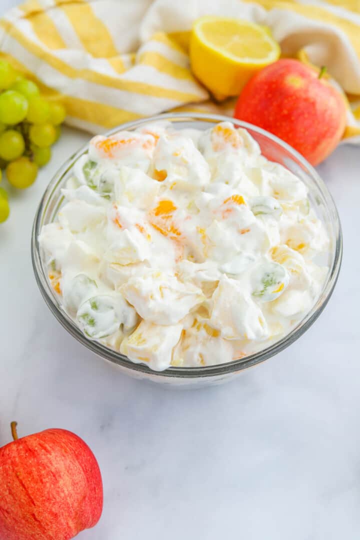 creamy fruit salad in large glass bowl.