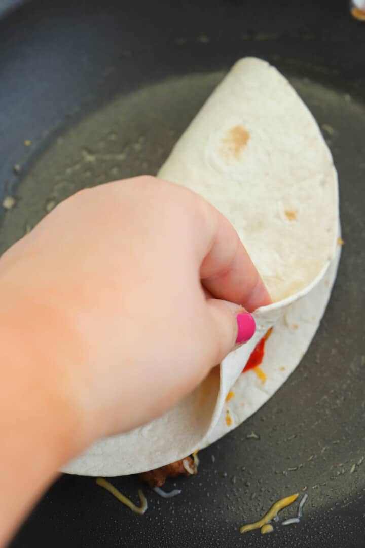 folding tortilla for the quesadilla.