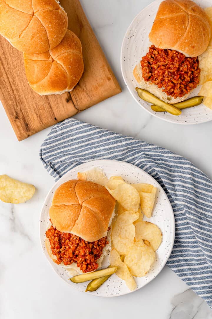 top view of Ground Turkey Sloppy Joes on plates with chips.
