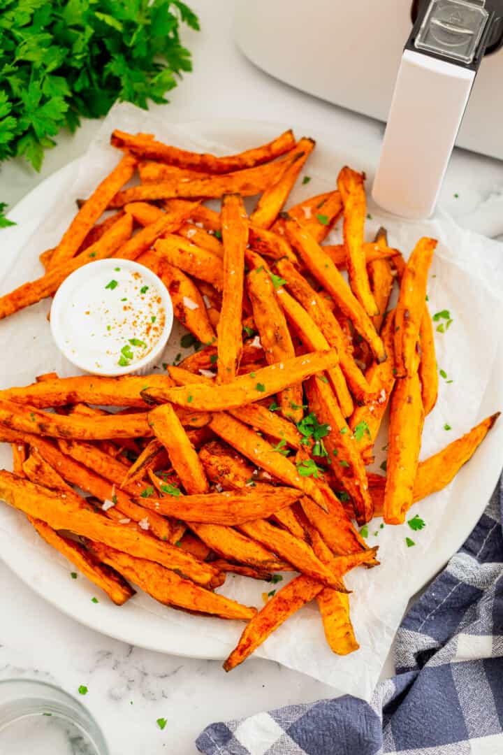 Air Fryer Sweet Potato Fries on white plate with dip.