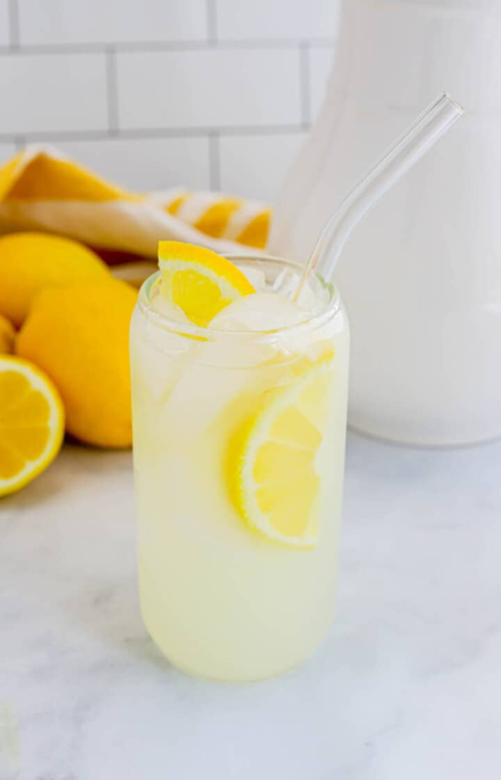 Homemade Lemonade in glass with lemon slice.