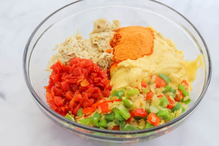 mixing the ingredients together for the casserole.