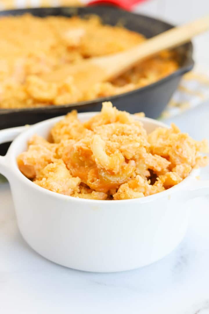 closeup of smoked mac and cheese in white bowl.