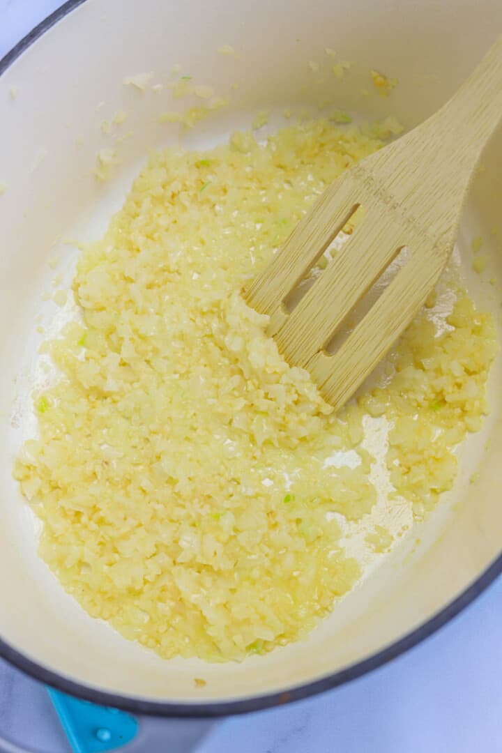 cooking garlic in large pot for green beans.