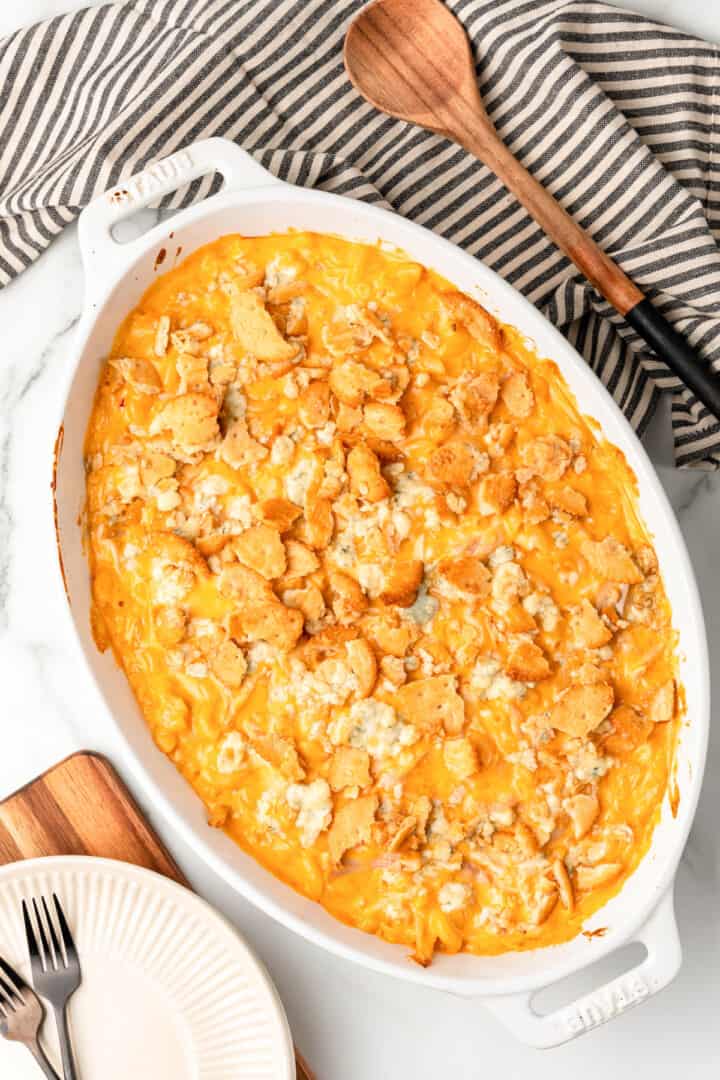 Baked Buffalo Chicken Mac and Cheese in casserole dish with Ritz cracker topping.