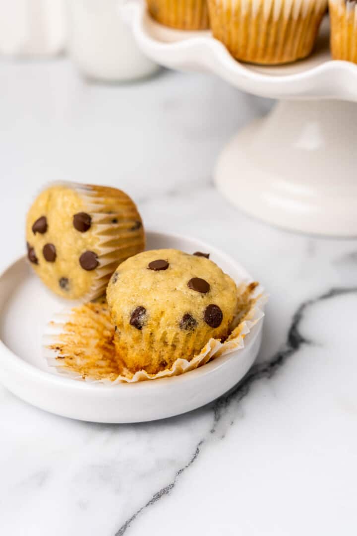 mini banana chocolate chip muffins on white plate.