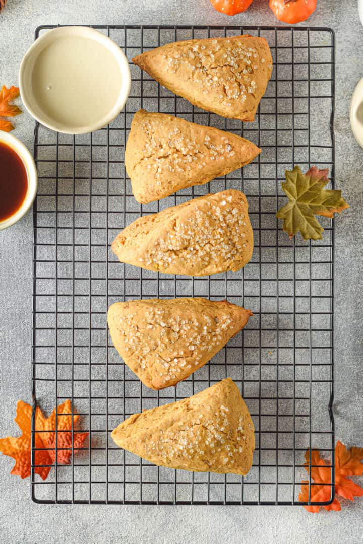 baked pumpkin scones on cooling rack.